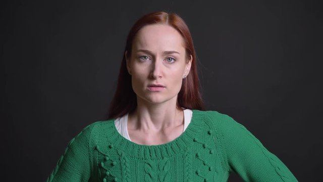 Closeup portrait of attractive caucasian female being angry frustrated and waving with her finger looking at camera