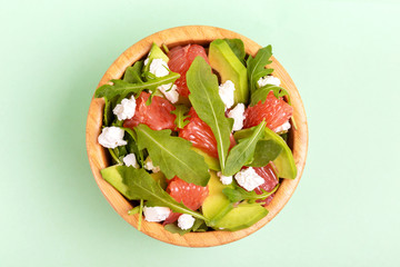 Delicious salad with grapefruit, spinach, feta and avocado
