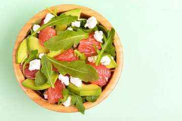 Delicious salad with grapefruit, spinach, feta and avocado