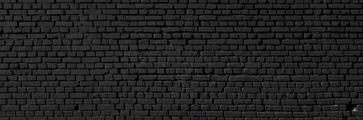 Black wall as background, texture of a black brick wall