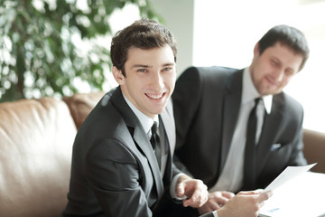 Fototapeta premium close up. a young businessman takes legal advice