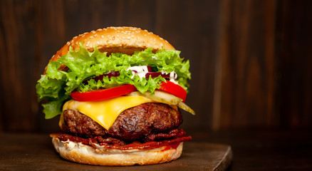 mouth-watering delicious homemade burger used to chop beef on the wooden table