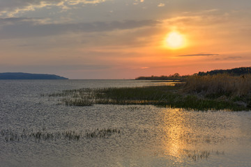 Sunset over the river in the spring