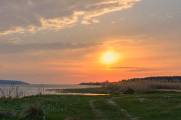 Sunset over the river in the spring