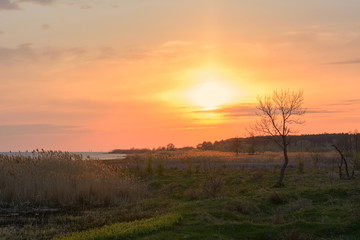 Sunset over the river in the spring