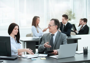Fototapeta premium Businessman analyzing investment, budget and income charts at his workplace
