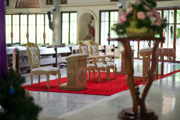 Fototapeta na wymiar Chair of the bride and groom Beautiful church For wedding ceremony - Images