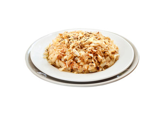 Fried cabbage with caraway and garlic on a plate isolated with clipping path