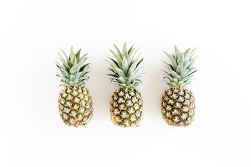 Pineapples isolated on white background. Food concept. Flat lay, top view