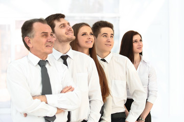 successful business team looking at copy space.