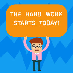 Word writing text The Hard Work Starts Today. Business concept for Starting making efforts to be successful Man Standing Holding Above his Head Blank Rectangular Colored Board