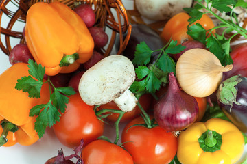 closeup.mushrooms and fresh vegetables in a wicker basket