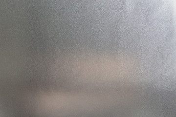 Silver background or metal foil shiny texture as abstract metal surface