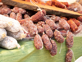 Close up of typical products of southern Itala Catania. These include salami with pepperoncino, fennel and aromatic herbs. All tasty Sicilian specialties.