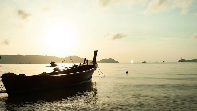 Longtail fishing boat with Beautiful clouds flowing in the dramatic sky 4K Time Lapse 