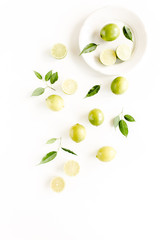Pattern made of lime and leaves ficus. Food concept.  flat lay, top view