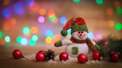 Christmas card. toy snowman on Christmas background.