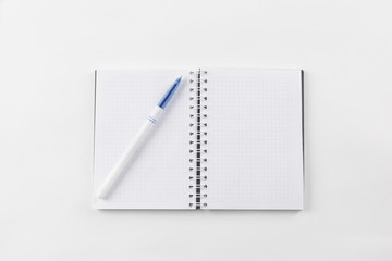 open notebook and pen on white background.photo with copy space