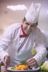 chef serving vegetable salad