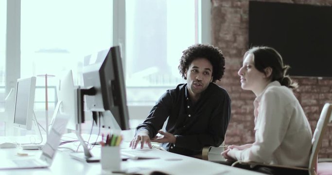 Coworkers in a casual meeting discussing work