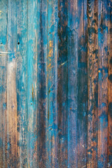 Fototapeta na wymiar Struktur alterr grunge blau gestrichener bemalter brauner verwitterter Holz Bretterwand mit rustikaler Holzmaserung