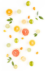 Creative background made of summer tropical fruits: grapefruit, orange, lemon, lime and leaves ficus. Food concept. flat lay, top view