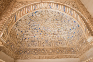 Closeup of a beautiful medieval time architecture seen inside Alhambra Palace. The architecture seems apalling and stunning with details. The design is similarly fascinating.