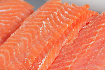Close up fresh salmon slices for sishi. Tradition japanishe seafood concept