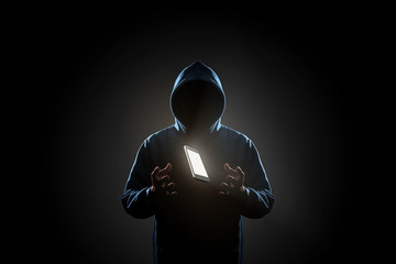White smartphone floating above of hacker's hand in dark background. Finance, business, e-commerce or cyber crime concept