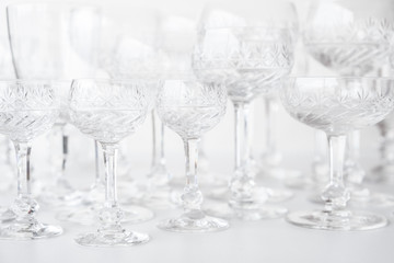empty crystal glasses on white table
