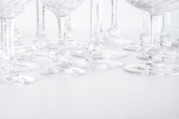 crystal glasses on white table, drinking glass