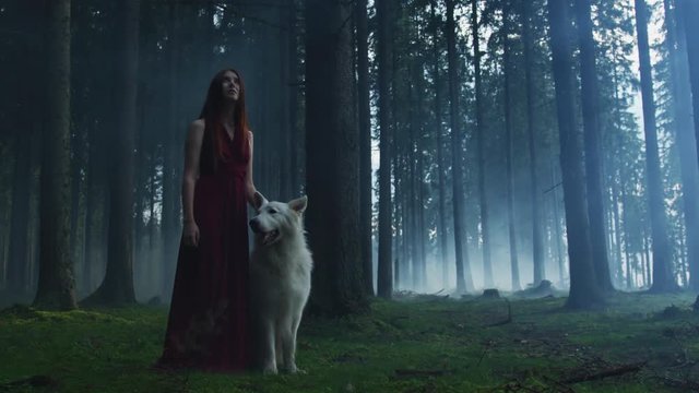 Girl with a dog in a forest