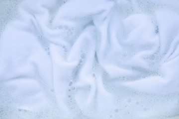 Soak a white cloth before washing