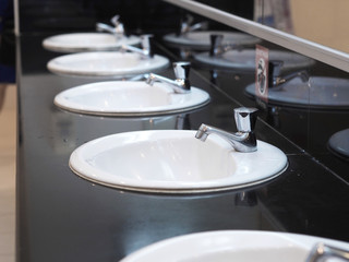 white basin at public toilet.