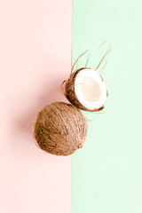 Cracked coconut on colorful background. Nature concept. flat lay, top view