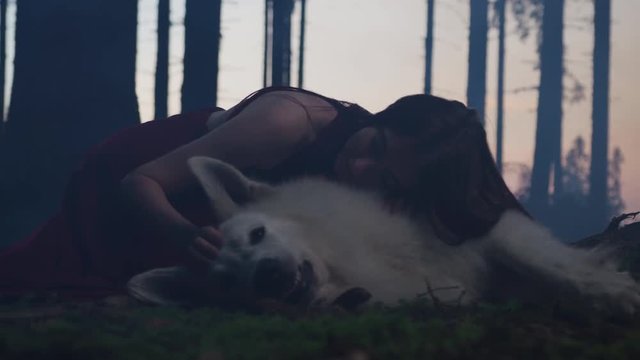 Girl caressing a dog