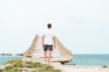 Young man standing in front of Old Seven Mile Bridge, Knights Key-Pigeon Key-Moser Channel-Pacet...