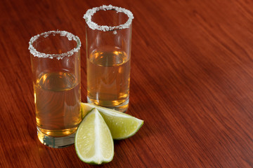 Golden tequila with lemon and salt. Drinks, Liquor