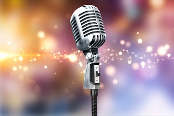 Retro style microphone on bokeh background