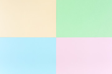 Background pastel colors: pink, yellow, blue, green. Geometric pattern papers. Minimal concept. Flat lay, Top view. 