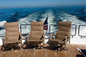 chairs on the aft deck of large yacht