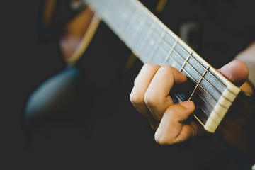 close up hand people playing guitar