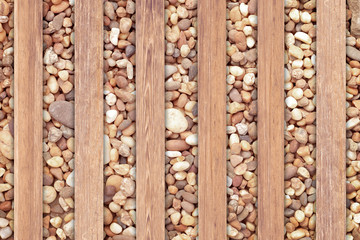 Wooden plate with stone wall background.