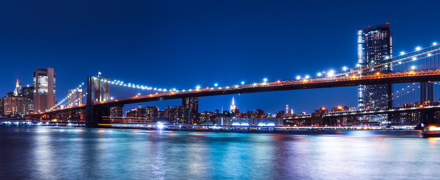 Brooklyn bridge with New York City view to Manhattan skyline at night
