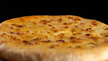 Georgian traditional food khachapuri on the wooden dish on black background
