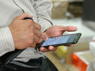 Touch screen mobile phone, in hand