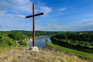 Fototapeta na wymiar cross above a vltava river