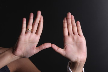 two hands isolated on black background