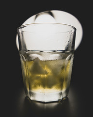 glass of whiskey with ice