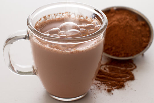 Hot Chocolate and Cocoa Powder Isolated on White